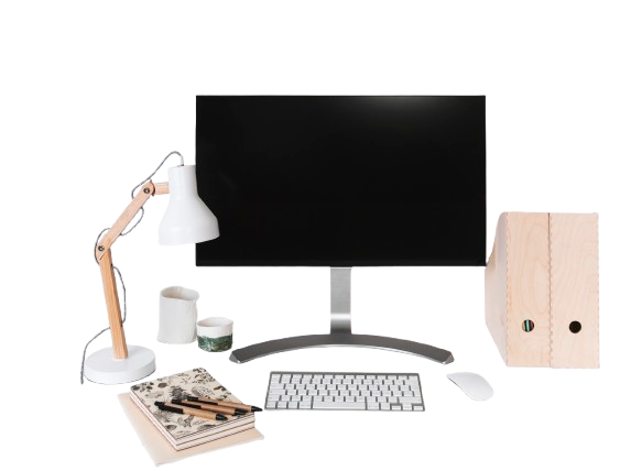 Minimalist home office desk setup with monitor, keyboard, lamp, and organizer.